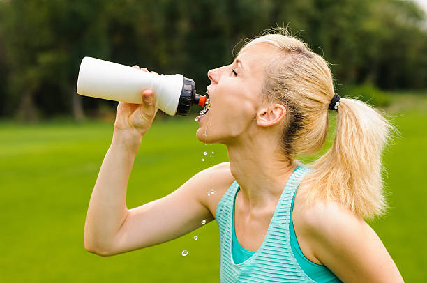 istock Young girl drinking water 158300346