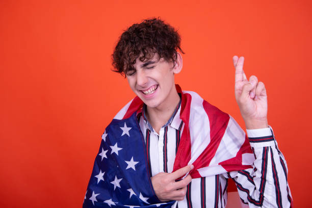 istock Young attractive guy with usa flag. 1583007414