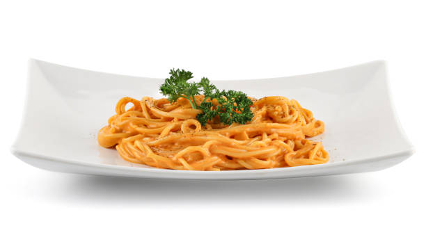 istock Fried spaghetti carbonara in a white plate isolated on white background with clipping path. 1583007437