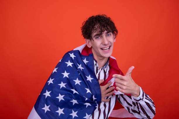 istock Young attractive guy with usa flag. 1583014056