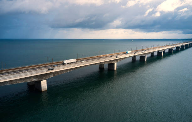 istock Highway - low West bridge over Great Belt with white truck 1583017919