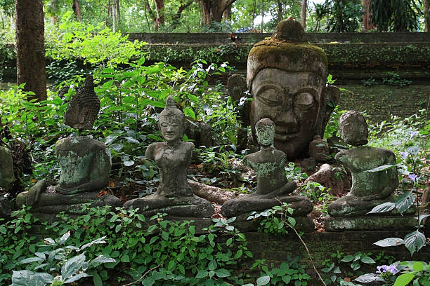 istock Ancient statues of Buddha in a forest temple (Chiangmai, Thailand) 158302438