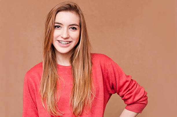 istock girl with braces 158302610