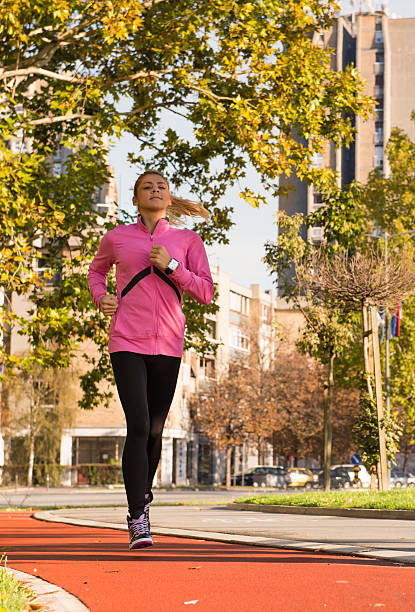istock young girl jogging 158302822