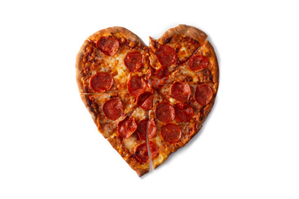 istock heart shaped pizza on white background for valentine's day 1583033794