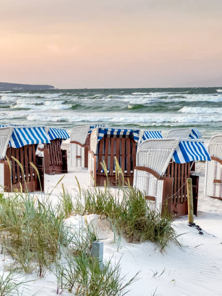 istock Sandy beach by the sea with dressing rooms. 1583045846