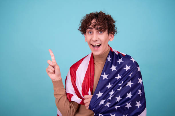 istock Young attractive guy with usa flag. 1583047516