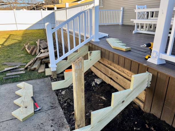 Staircase Repair The stairs to a deck are demolished. The wood, framing, and composite boards are laying on the lawn. faux wood stock pictures, royalty-free photos & images