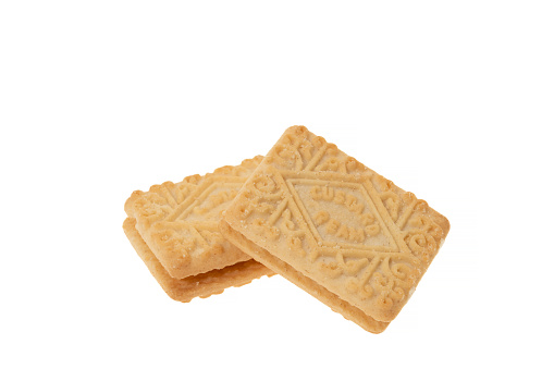 Delicious baby wheat cookies on an isolated white background. Fresh confectionery biscuit.  File contains clipping path.