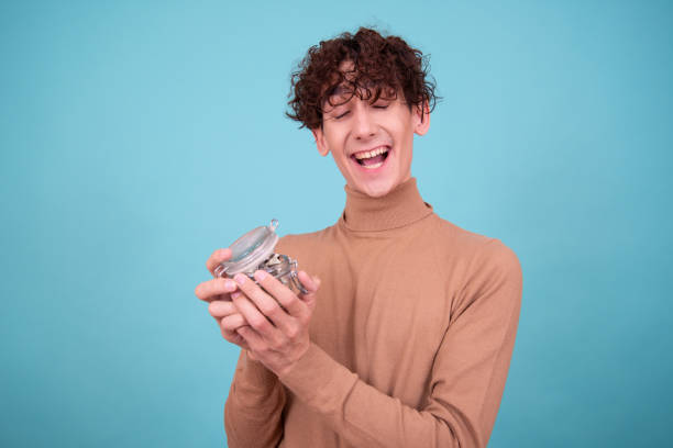 istock A young attractive guy saves money for a gift. 1583058574
