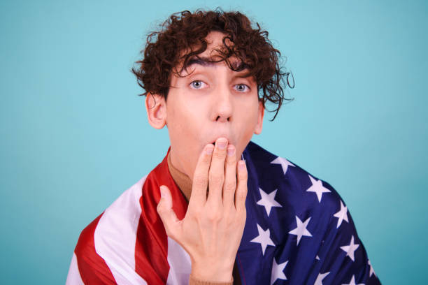 istock Young attractive guy with usa flag. 1583059136