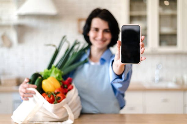 istock Selective focus on woman hand holding smartphone with empty screen 1583062547