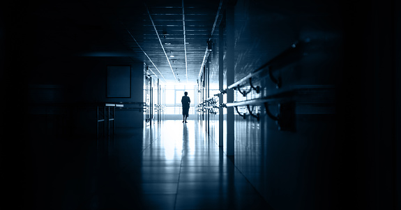 People walking in hospital corridor