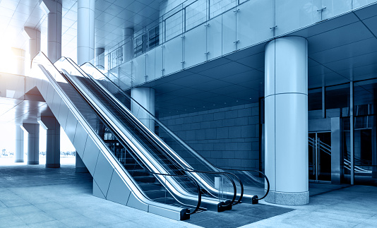 Two escalators in modern office building