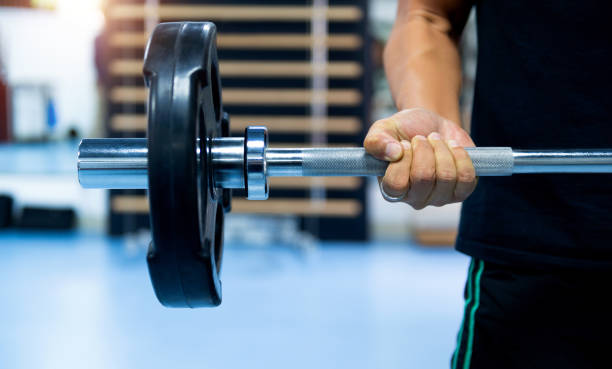 istock Single man with training equipment on sport gym 1583073604