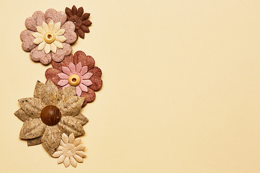 Arrangement of flowers made of rough textured felt.