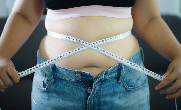 Obese Woman with fat belly in dieting concept. Overweight woman touching his fat belly and want to lose weight. Fat woman her waist with a centimeter.
Shape up healthy stomach muscle and diet lifestyle Obese Woman with fat belly in dieting concept. Overweight woman touching his fat belly and want to lose weight. Fat woman her waist with a centimeter.
Shape up healthy stomach muscle and diet lifestyle concept. pudgy woman pictures stock pictures, royalty-free photos & images