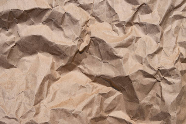 старая текстура коричнево-желтого стиля винтажный картонный лист пустого бумажного фона. - brown paper paper crumpled brown стоковые фото и изображения