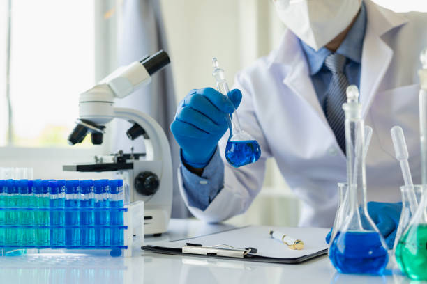 istock Scientists working under a microscope analyzed a sample of blue velu in vitro. Young biotechnology specialists using advanced equipment in the Medical Science Laboratory: 1583109616