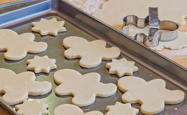 Gingerbread boy and star Christmas cookies on sheet