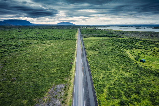 istock Highway road through mossy remote wilderness by coastline in summer 1583153139
