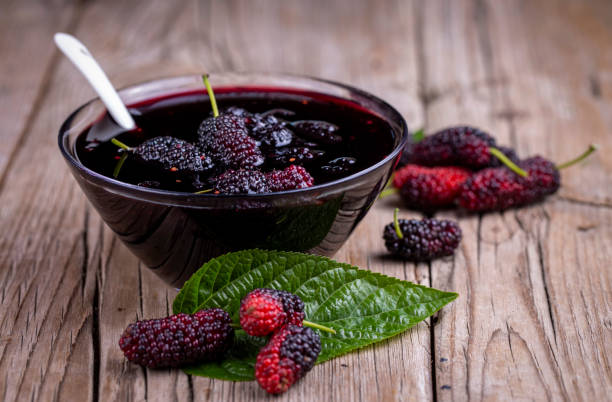 istock Domestic fresh mulberry jam on a rustic wooden board 1583153140