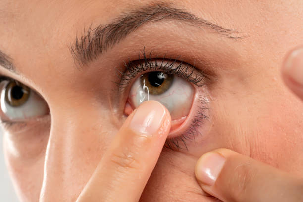 istock woman wearing contact lens 1583159274