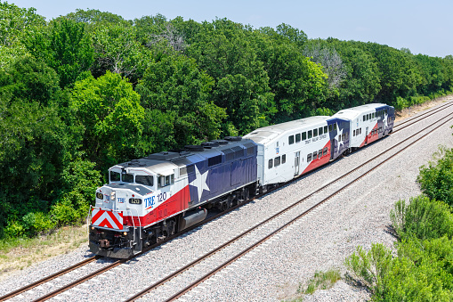 Dallas, United States - May 5, 2023: Trinity Railway Express TRE commuter train public transport in Dallas, United States.