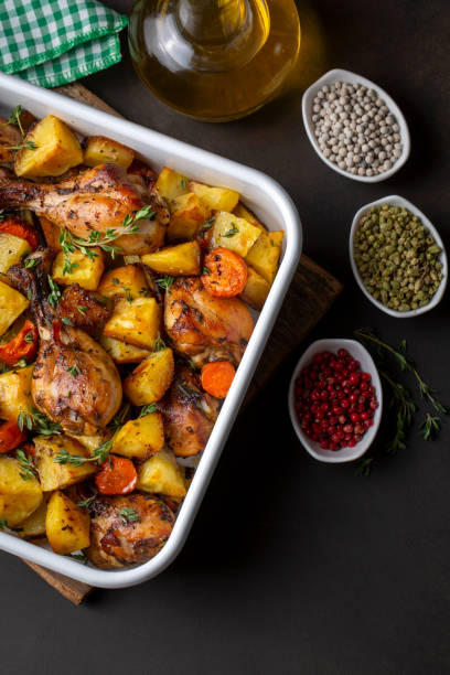istock Baked chicken thighs and fried potatoes look delicious. 1583169720