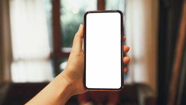 istock Women's hands holding cell telephone blank copy space screen. smartphone with blank white screen isolated on white background . smart phone with technology concept 1583175336