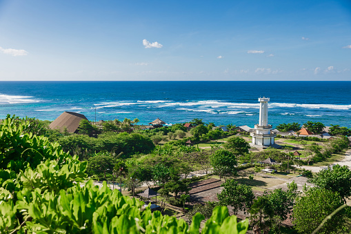 Pandawa beach in Bali island. Scenic coastline with lighthouse and blue ocean.