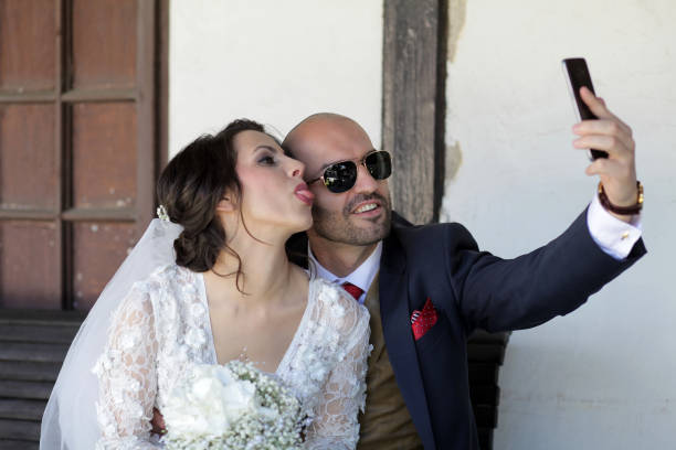 istock Wedding couple takes a selfie 1583200149