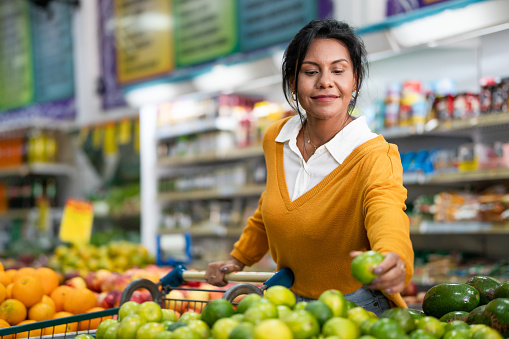 Customer chooses lemon in a neighborhood store