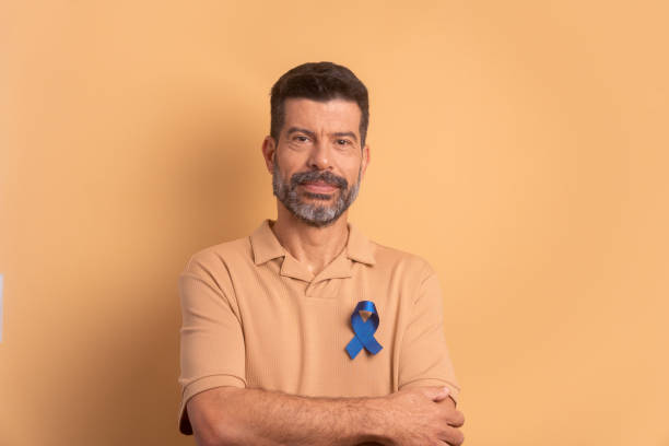 istock man showing blue ribbon. prostate cancer awareness campaign 1583202300