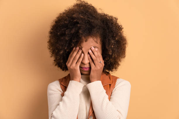 istock annoyed woman with hands over the face 1583204210