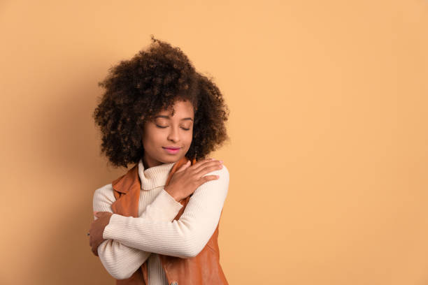 istock woman embracing self care. 1583209513