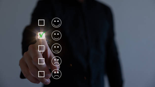 istock Businessman pressing smiley face emoticon on virtual touch screen. Customer service evaluation concept. 1583217023