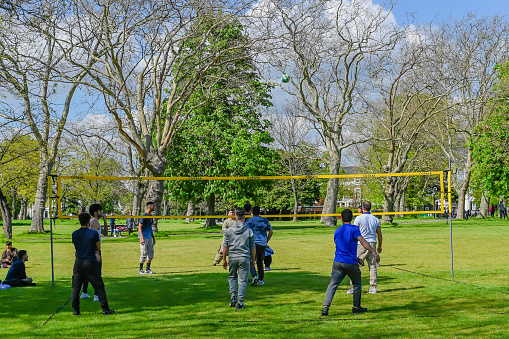 London, UK,  6 May 2023 : People playing volleyball in London Park