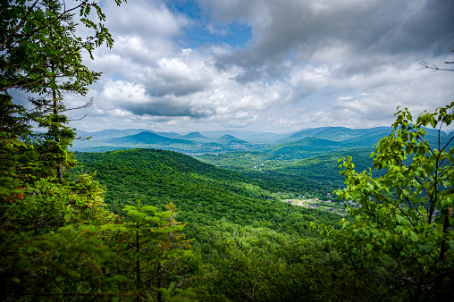 Nice viewpoint over the mountains and the boreal forest and its vibrant foliage around Sainte-Brigitte-de-Laval village, Quebec, Canada