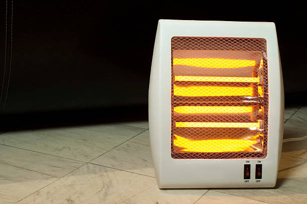 istock Electric heater blowing hear through grate 158323664