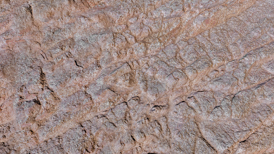 Detail of rocks and brown sandstone texture with space for background and space for text.