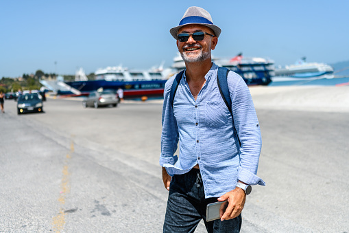 Mature man disembarking from a Greek ferry