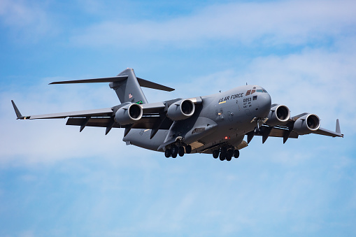 Papa, Hungary - May 11, 2021: Military transport plane at air base. Air force flight operation. Aviation and aircraft. Air lift. Military industry. Fly and flying.