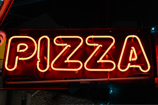 neon sign with pizza word. High quality photo