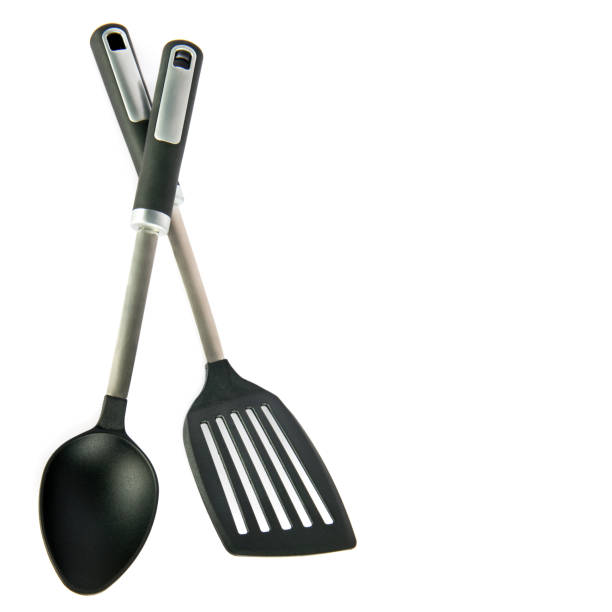 istock Kitchen spatula and spoon isolated on white . Free space for text. 1583341765