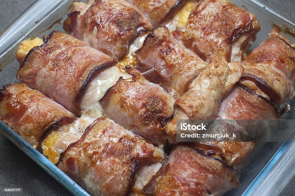 Bacon rolls A pile of baked rolls of chicken meat wrapped in pieces of bacon Cooking Stock Photo