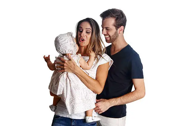 Image from Brazilian iStockalypse (MIS) Sao Paulo - Young Brazilian couple with a baby on lap isolated on white background.