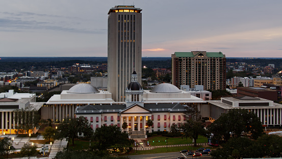 Drone shot of the Florida State Capitol Building in Tallahassee at sunset.