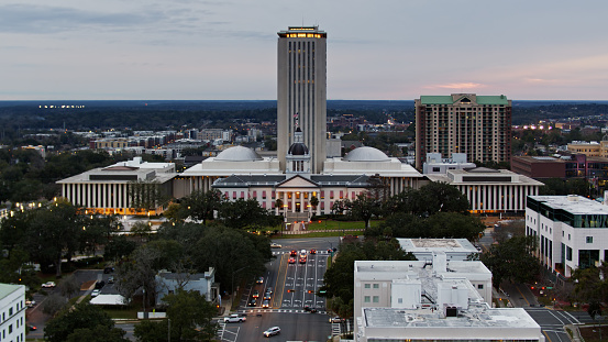 Drone shot of the Florida State Capitol Building in Tallahassee at sunset.