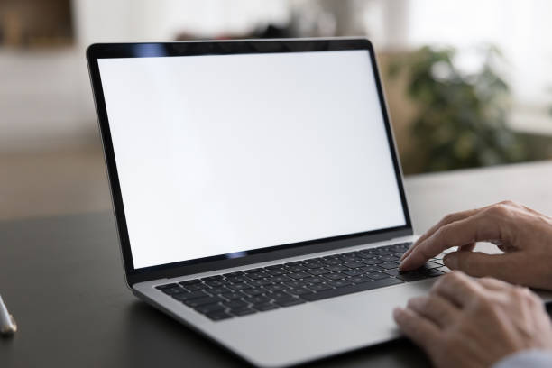 istock Empty white laptop display on work table of business woman 1583408736